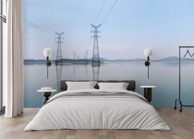 electricity pylon on lake Wall mural