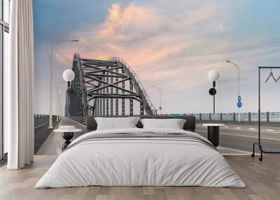 steel bridge and road with sunset sky Wall mural