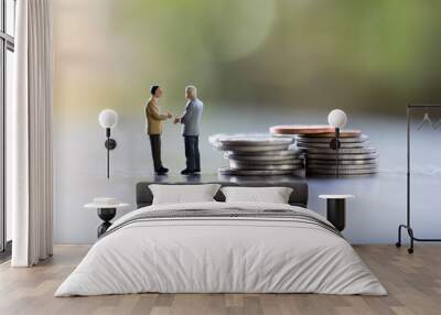 Two Business man,saving and finance concepts. Miniature people Stand in front of a coin,soft focus and blurred style. Wall mural