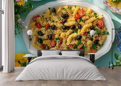 A vibrant pasta salad with rotini, cherry tomatoes, olives, and herbs, perfect for a summer gathering or picnic. Wall mural