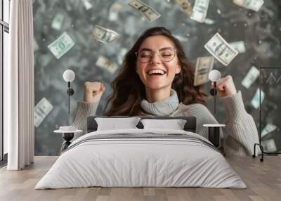 Image of a smiling and wealthy young woman with money flying around her. Wall mural