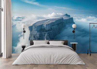 The peak of a natural mountain soaring high into the sky with white clouds floating all over the mountain. The photo is inspiring and imaginative. Wall mural