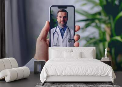 Man hand holding mobile phone with doctor connection network video call. Medical healthcare  Wall mural