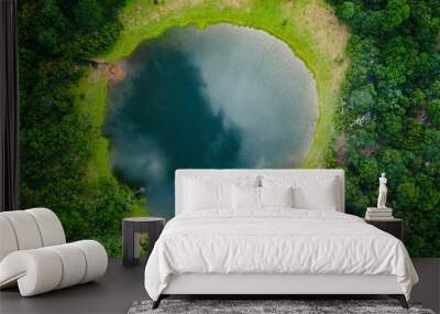 Aerial view of natural pond surrounded by pine trees in Fanal, Madeira island, Portugal Wall mural