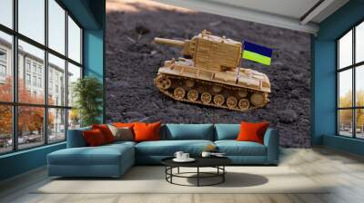 Tank on the ground with the flag of Ukraine Wall mural