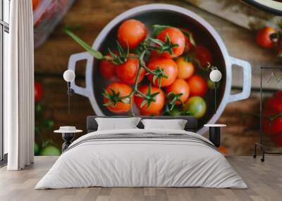 Fresh cherry tomatoes on rustic wooden table, Top view with copy space. Wall mural