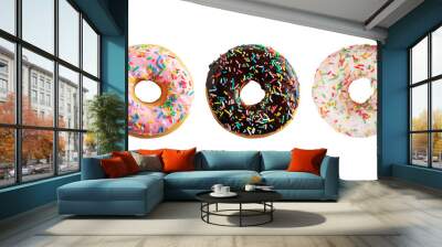 Three donuts with sprinkles isolated on white background. Top view. Wall mural