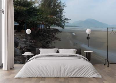 Morning ambience at the beach with mountain background  Wall mural