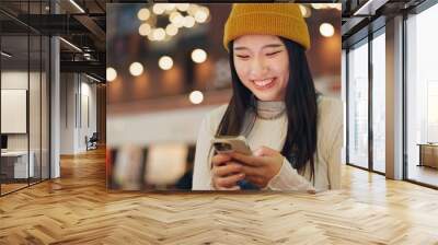 Phone, search and Japanese woman in city for travel, chat or map navigation outdoor. Smartphone, smile or happy lady person in Japan with app for location, guide or taxi, service or chauffeur request Wall mural