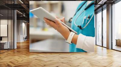 Woman, vet and hands with tablet for research on animal medicine, study or browsing at clinic. Closeup of female person or veterinarian scrolling on technology for medical search or pet treatment Wall mural