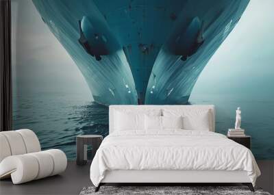 the bow of a large blue shipping vessel cuts through the sea showcasing global maritime transport and logistics Wall mural