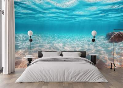 underwater view of a tropical beach, featuring clear blue water and pristine white sand, offering a peaceful and serene ocean scene in a natural paradise Wall mural