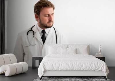 Male doctor with stethoscope in medical uniform showing blue pills Wall mural