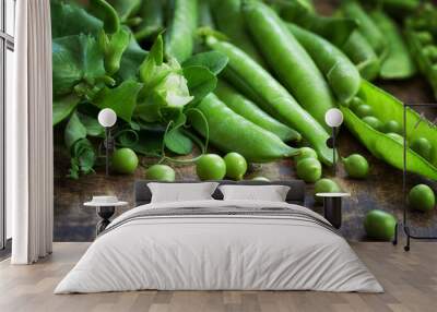 Ripe Green peas on wooden table Wall mural