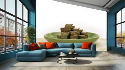 Stack of coin in green plate Wall mural