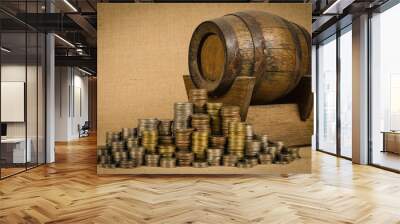 Stack of coins with wooden barrel Wall mural