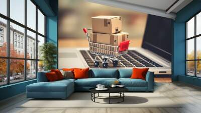 .Trolley boxes atop a laptop keyboard. Insights on e-commerce, a mode of digital trade enabling customers to purchase goods directly from online sellers over the internet. Wall mural