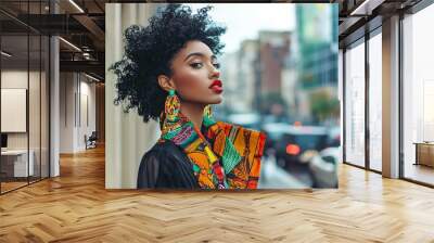 A trendy young woman displays her vibrant collection of statement earrings and scarves in a chic city setting. Wall mural