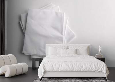 A white napkin mockup with utensils and a blank towel for branding purposes. Wall mural