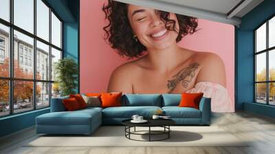 Gorgeous brunette in casual attire on pink backdrop, embracing oneself with a joyful, self-assured smile. Embracing self-love and self-care. Wall mural