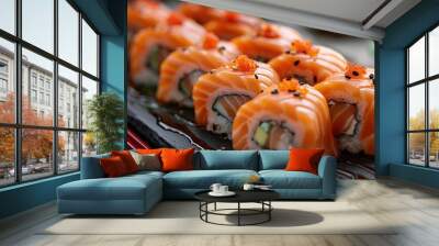 Traditional Japanese dish of salmon rolled in sushi rice and served with red eating utensils on a plain backdrop. Wall mural