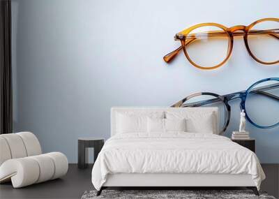 Two sets of plastic and metal glasses on a blank backdrop. A simplistic, stylish portrayal of eyewear. Current trend in minimalistic frames. Special deals at an optical store. Wall mural