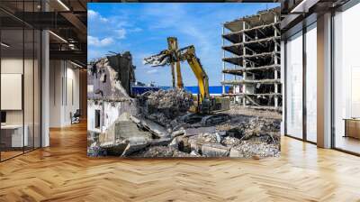 Building House Demolition site Excavator with hydraulic crasher machine and yellow container Wall mural