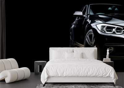 Black generic and unbranded sport car isolated on a black background with copyspace Wall mural