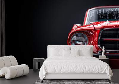 Closeup on a generic and unbranded old red car on a black background Wall mural