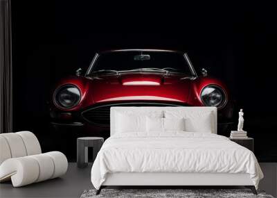 Front view of a red sport car isolated on a dark background Wall mural