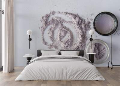 Pearlescent sparkling eye shadow scattered on the table, a jar of shadows Wall mural