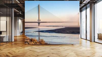 Cable-Stayed River Crossing Mersey Gateway Bridge in winter with fog Wall mural