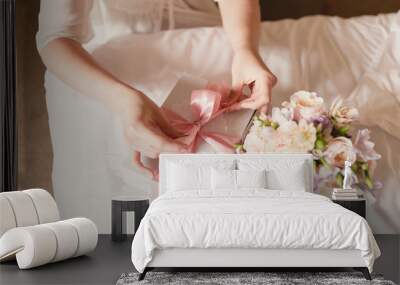 The bride opens her gift on the wedding day Wall mural