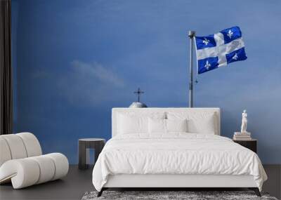 The Quebec flag under a blue sky Wall mural