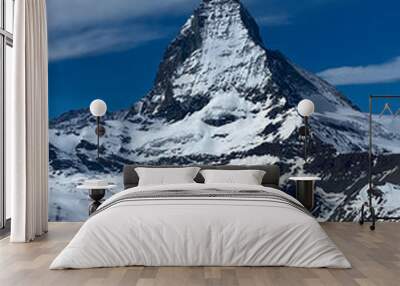 Impressive View in cloudy Sky to the Matterhorn Mountain in Switzerland Wall mural