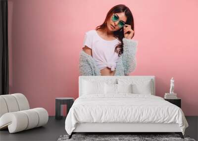 Fashionable full length image of  woman with long ginger hair happy laughing to camera. Indoor photo of blissful caucasian girl in trendy sunglasses and mint green  jacket. Wall mural