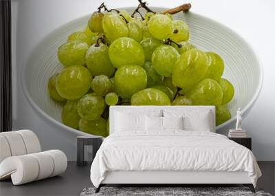 Fresh green grapes in a bowl, isolated on white background Wall mural