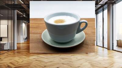 Italian cappuccino in a ceramic cup, wooden table, white background Wall mural