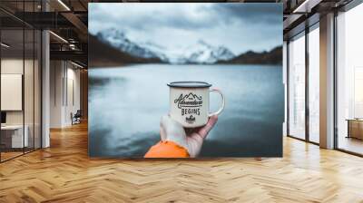 Close-up of male hand holding mug. The adventure begins travel,hiking and camping concept Wall mural