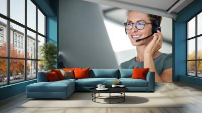 Customer service, woman and happy call center agent giving advice online using a headset. Operator, telemarketing and support with hotline consultant working for contact us help or arm consulting Wall mural