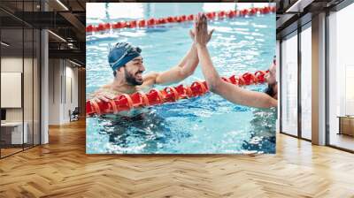 Fitness, success or friends high five in swimming pool to celebrate winning a team sports competition. Target, happy or excited men in celebration with support or motivation in a training workout Wall mural