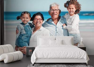 Portrait, travel and happy family at a beach, bonding and having fun outdoors against sea background. Face, seniors and man with woman enjoying retirement with grandchildren on ocean trip in Miami Wall mural