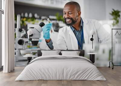 Science, sustainability and sample with a black man doctor working in a laboratory for research or innovation. Biology, microscope or healthcare with a male scientist at work in a lab for development Wall mural