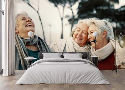 Comedy, laughing and senior woman friends outdoor in a park together for bonding during retirement. Portrait, smile and funny with a happy group of elderly people bonding in a garden for humor or fun Wall mural