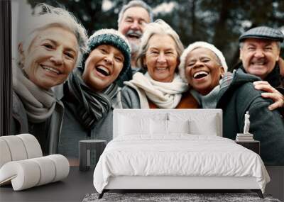 Happy, selfie and senior friends in a park while walking outdoor for fresh air together. Diversity, smile and group of elderly people in retirement taking picture and bonding in a forest in winter. Wall mural