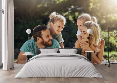 Picnic park and family with children relax on grass together for outdoor bonding, love and care with sunshine summer lens flare and trees. Nature, healthy and support parents with girl kids on ground Wall mural