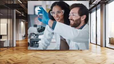 Teamwork, collaboration or blood test tube in laboratory research success, dna engineering innovation or medical vaccine. Smile, happy man or black woman with scientist sample for pharmacy medicine Wall mural