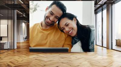 Happy couple, laptop and relax in home for love, watch comedy movies or scroll website for online shopping. Man, woman and laugh for funny joke on computer, social media subscription and meme on sofa Wall mural