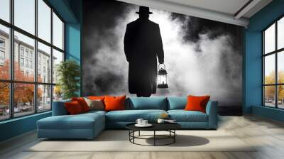 A man is walking down a street with a lantern in his hand Wall mural