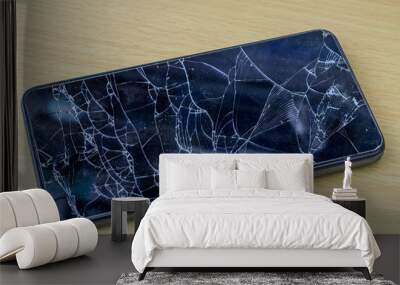 Broken glass on a black smartphone Wall mural